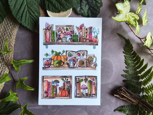 Carte Bibliothèque Automnale – Livres, Citrouilles et Maisons Douillettes