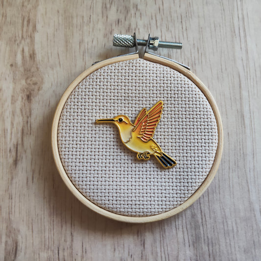 Pin's Grand oiseau colibri jaune